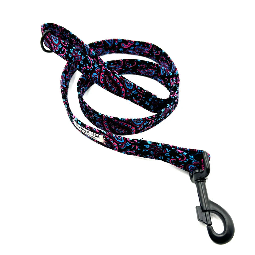A blue paisley corduroy dog lead with a comfortable loop handle and a strong, antique-style steel trigger clip.