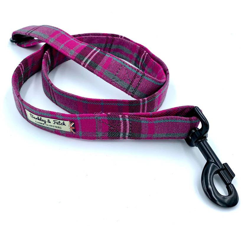 A pink and grey tartan pattern dog lead with a comfortable loop handle, an attachment ring, and a steel trigger clip.