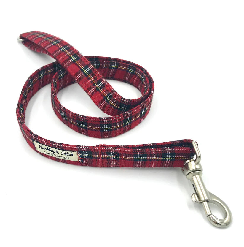 A red Stewart tartan dog lead with a comfortable loop handle, an accessory attachment ring, and a strong steel trigger clip.