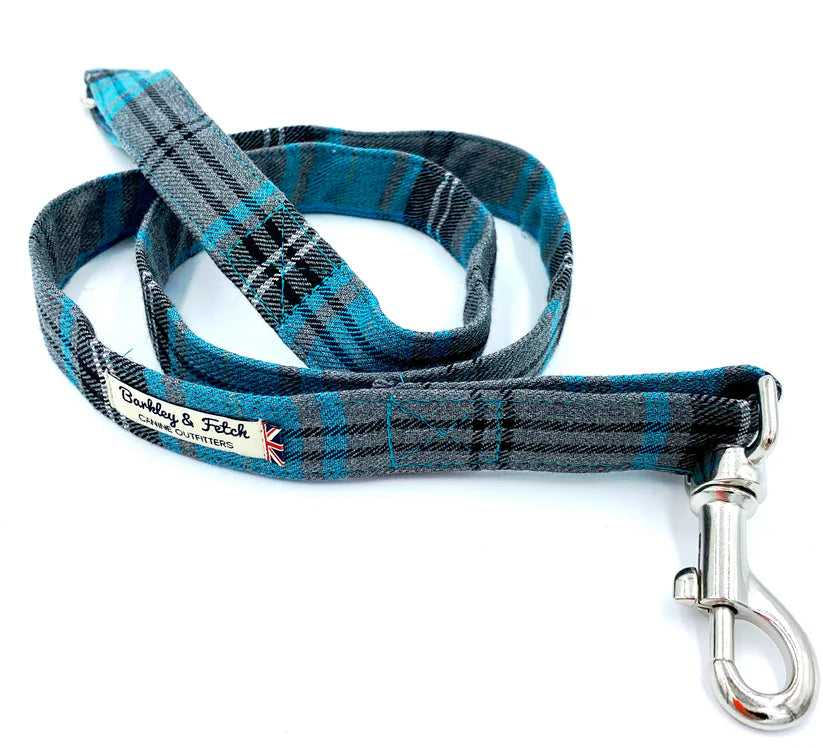 A turquoise and grey tartan pattern dog lead with a comfortable loop handle, an accessory attachment ring, and a strong steel trigger clip.